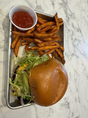 Black-eyed pea burger with sweet potato fries .