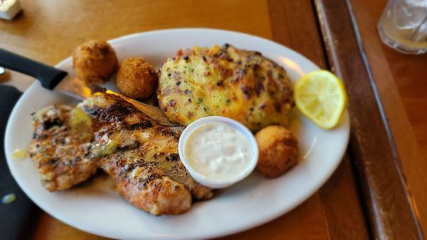 Blackened grouper with twice baked potato and hush puppies