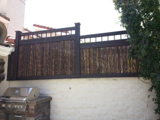 bamboo and redwood fence with picket accent