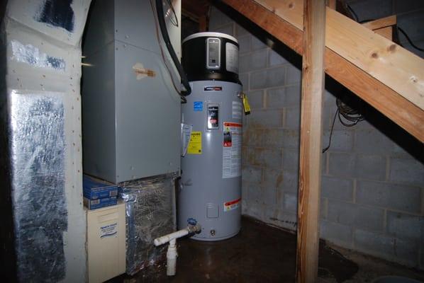 High efficiency heat pump water heater, relocated to an out of the way area underneath a staircase.