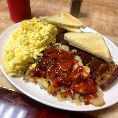 Pork sausage, cheese eggs, hash browns and toast.