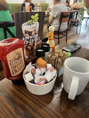 Cute table for two. Raw sugar and cream for coffee. New mint mocha iced coffee.