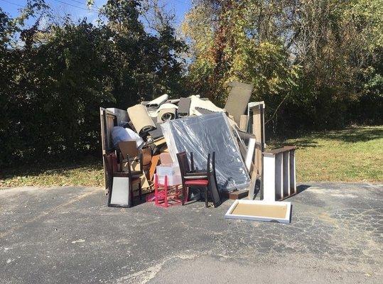 Bulk dumpster in a apartment complex. The city left this for weeks and we came and got the job done.