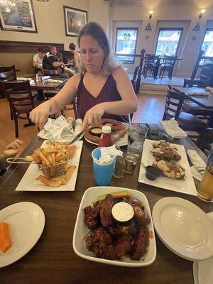 Wings and fries and some Sheppards pie filled potato skins