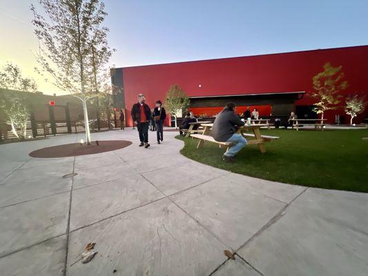 Before sunset, come early. Get a drink. Several picnic tables on the lawn.