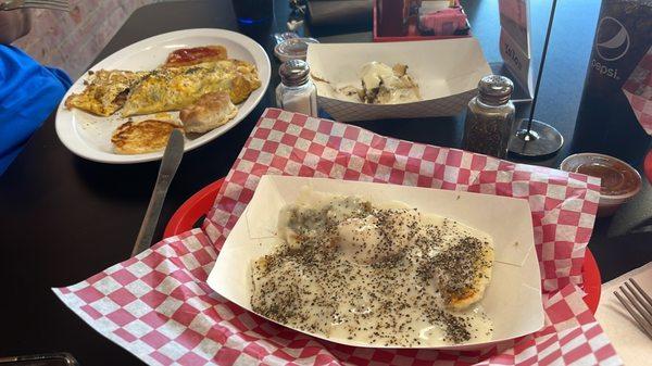 Biscuits and gray with sausage. Omelette with sausage and ham cinnamon roll.