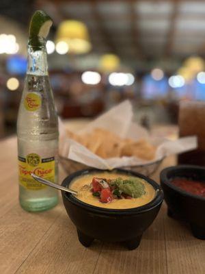 Loaded queso and a cold Topo!