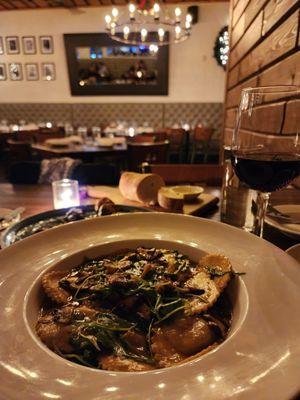 Mushroom ravioli and a glass of pinot noir.