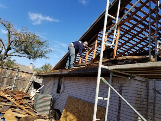 Hard at work rebuilding a gable.