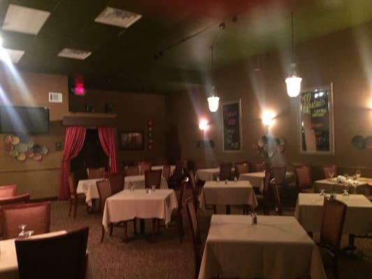 The dinning area with linen table cloths, a slightly upscale experience while eating a home cooked meal.