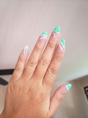 Gel nails with length added, plus design