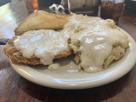 Chicken Fried Steak with mashed potatoes and gravy.