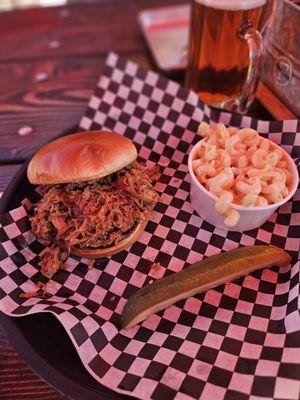 Pulled pork sandwhich with Mac n cheese side.