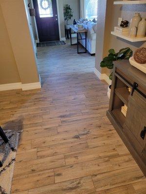 Wood-plank porcelain tile throughout the entire house.