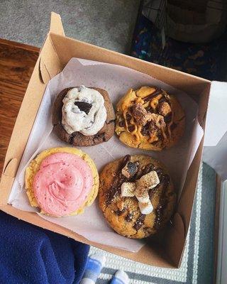 raspberry lime sugar cookie, oreo cookie, s'mores cookie, and peanut butter reese's cookie!  so delicious i ate the whole box!