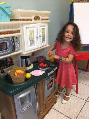 Brie making red sauce in the kitchen!