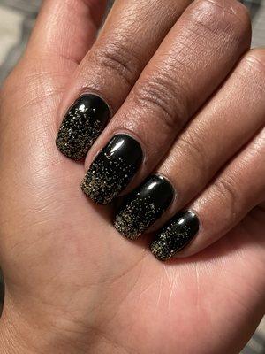 Gel manicure with gold glitter