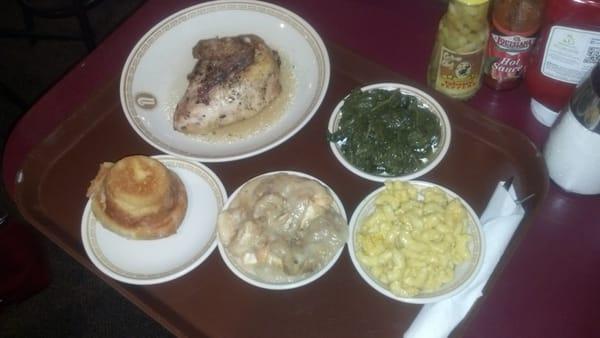 Clockwise from left: the famous yeast roll and Greek chicken entree, spinach, mac n cheese, and banana pudding