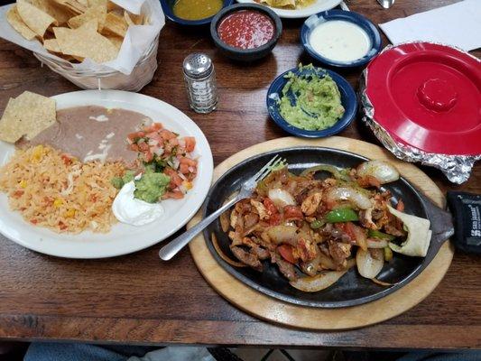 Fajitas  with small cheese dip,  and small guacamole.