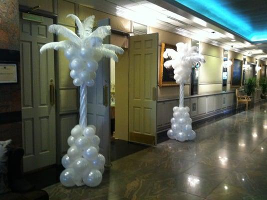 White feather balloon columns or palm trees