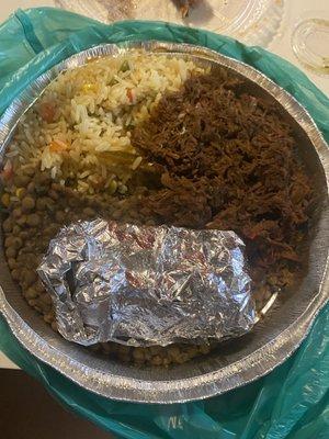 Ropa vieja with yellow rice and lentils and yuca