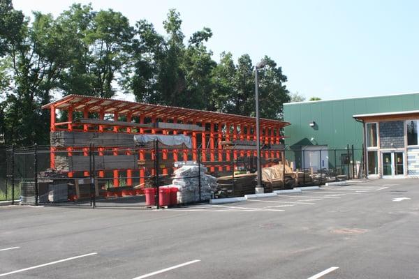 The lumber yard outside of EcoBuilding Bargains at 83 Warwick Street in Springfield, MA.