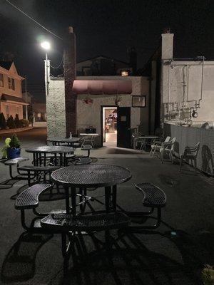 Rear of the building with tables and chairs