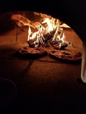 Wood fired pizza made with fresh ingredients and hand kneaded dough!