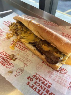 Cheese steak sandwich with onions and whiz cheese sauce