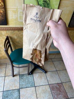 This is how the sandwich was served. Not wrapped, just leaking in a paper bag.