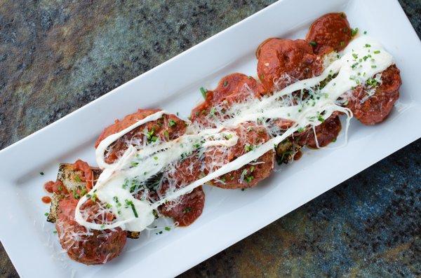 yak meatballs house made fresh mozzarella, house made marinara, focaccia toast, fresh herbs, tuscan herb evoo, shaved parmesan.