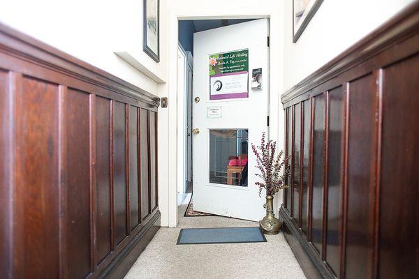 Second floor hallway leads to the office entrance