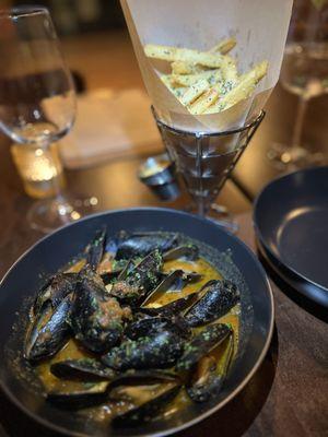 Moules Frites. Fresh Mussel, wine, chimichurri, splash of tomato sauce with fresh fries...yum!!