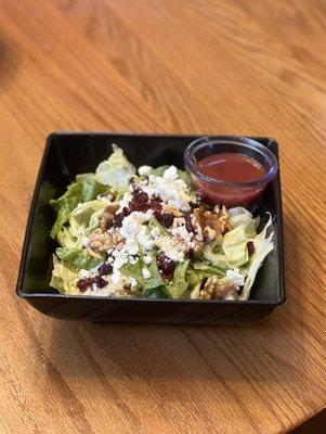 The cranberry walnut salad is a must try on our menu, recommended with the raspberry vinaigrette dressing.