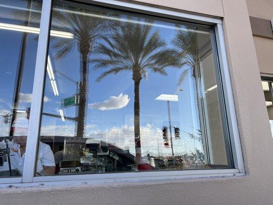 Looking in as they cut fries, the palm tree wanted to photo bomb