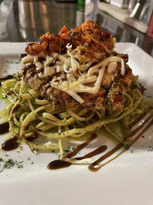 Chicken Caprese
 Seared chicken, fresh mozzarella, bruschetta, basil pesto linguini, balsamic reduction