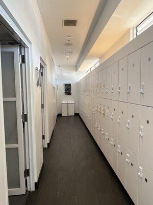 Lockers on the right, restrooms and showers on the left