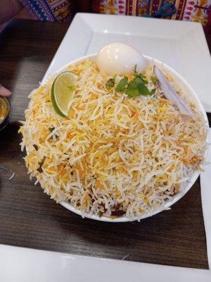 Chicken Biryani with rice and boiled egg.