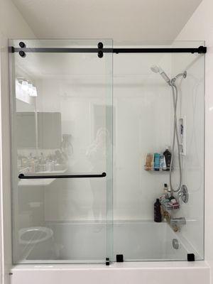 Frameless glass shower door installed