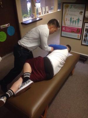 Aj getting his adjustment by Dr Palmes