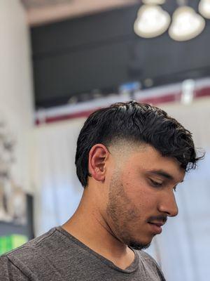 Mullet style haircut with shear work