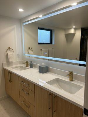 New custom cabinetry and counter tops, lighted mirror