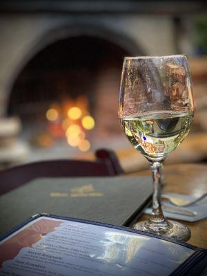 Wine, menu and roaring outdoor fireplace.