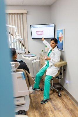 Dr Saini explaining the Invisalign process.