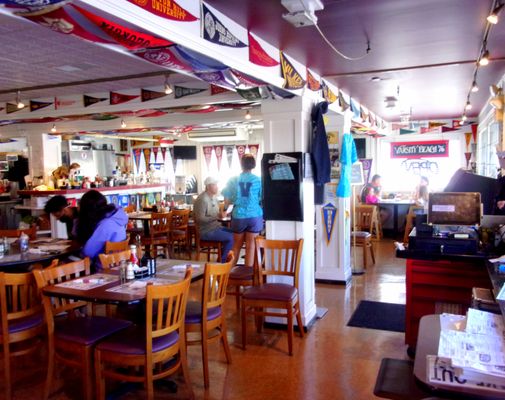 College pennants on the walls add to the collegiate atmosphere