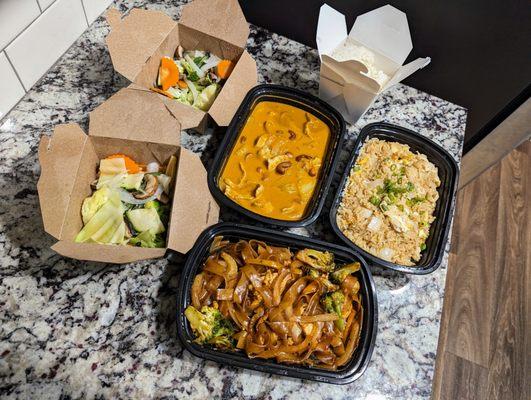 Tonight's takeout order. Massaman Curry, Fried Rice, and Pad Kee Mao, all with chicken. Two steamed vegetables. $61.98 after tax and tip.