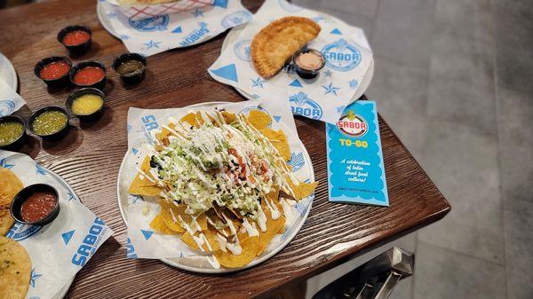 Nachos with chorizo and beef empanada