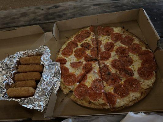 Pepperoni pizza and mozzarella sticks