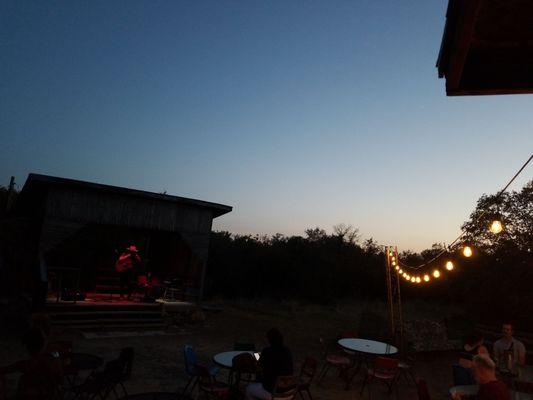 fairy lights and music stage in the backyard hangout with a concessions stand!