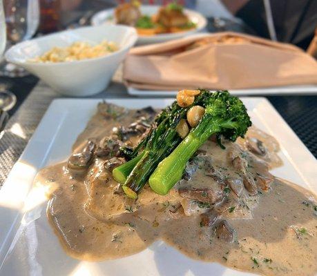 Jäger Schnitzel: Pork schnitzel braised in a mushroom cream sauce, spätzle, broccolini, garlic confit | $38